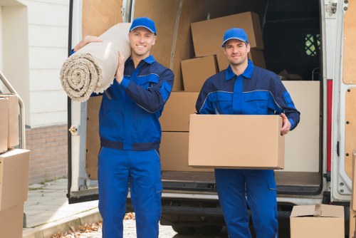 Man with van service loading furniture in Bow street setting