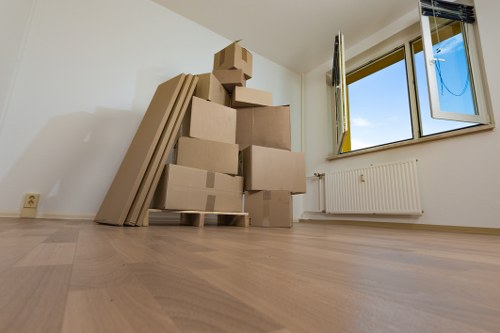 Flat removals team planning a move in Bow apartment building
