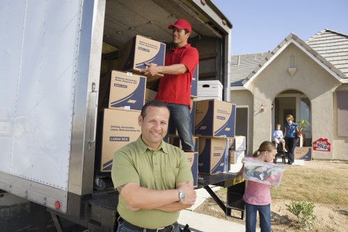 Careful loading of furniture and boxes for a flat move in Bow
