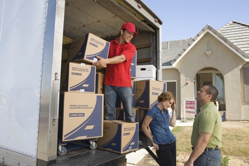 Professional removals crew working at a Bow property