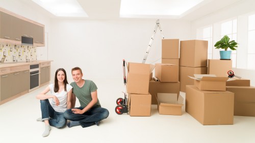 Packing boxes and furniture ready for local storage in Bow