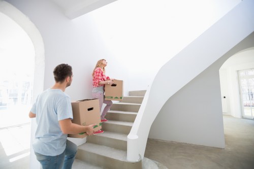 Trained movers handling furniture with care in Bow