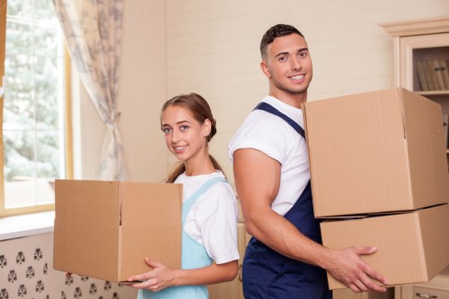 Careful wrapping of fragile items during a Bow packing service